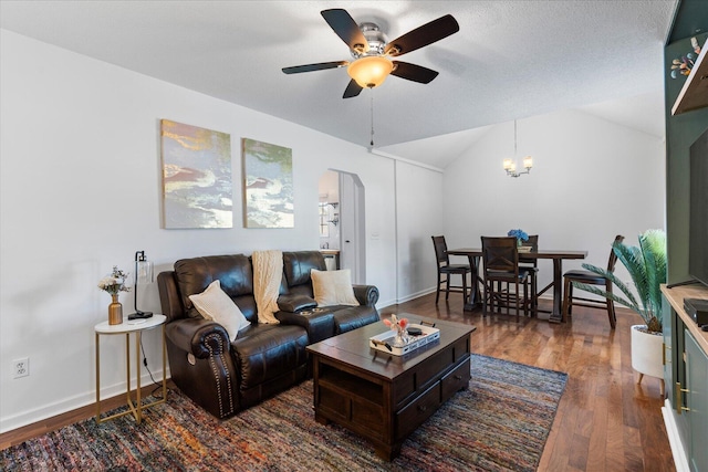 3305 Redding Rd, Chattanooga, TN 37415 - living area featuring arched walkways, dark wood-type flooring, a ceiling fan, lofted ceiling, and a chandelier