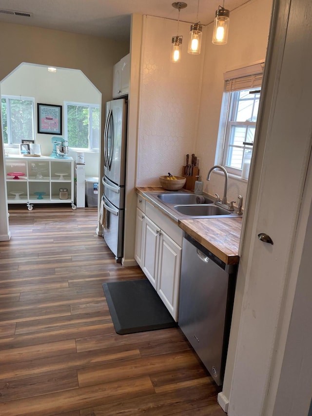 3305 Redding Rd, Chattanooga, TN 37415 - kitchen with stainless steel appliances, butcher block counters, white cabinetry, dark wood finished floors, and healthy amount of natural light