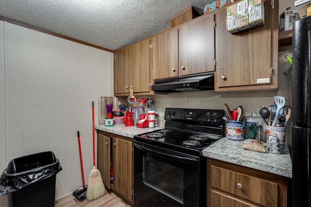 4259 Keith Valley Rd, Cohutta, GA 30710 - kitchen with black appliances, under cabinet range hood, light wood finished floors, a textured ceiling, and brown cabinetry