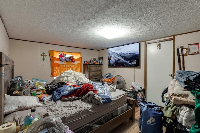 4259 Keith Valley Rd, Cohutta, GA 30710 - bedroom featuring wood finished floors and a textured ceiling