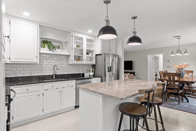28 Lynn Rd, Signal Mountain, TN 37377 - kitchen featuring appliances with stainless steel finishes, a center island, white cabinets, dark stone countertops, and recessed lighting