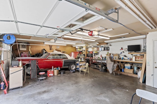 28 Lynn Rd, Signal Mountain, TN 37377 - garage with a garage door opener and a workshop area