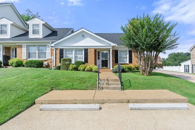 6756 Hickory Manor Cir, Chattanooga, TN 37421 - view of front of property with brick siding, a front lawn, and a shingled roof