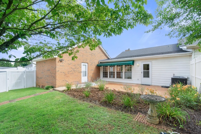 6756 Hickory Manor Cir, Chattanooga, TN 37421 - back of property featuring a patio area, brick siding, and a gate