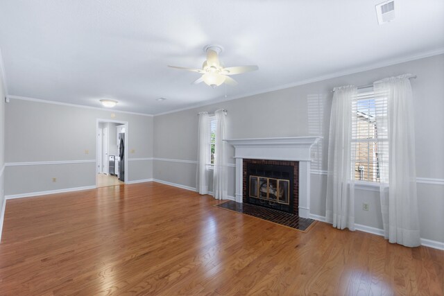 6756 Hickory Manor Cir, Chattanooga, TN 37421 - unfurnished living room with ceiling fan, a fireplace, and wood finished floors