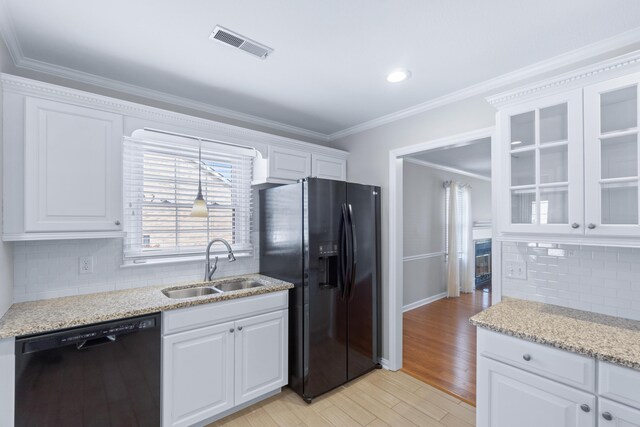 6756 Hickory Manor Cir, Chattanooga, TN 37421 - kitchen featuring dishwasher, black fridge, white cabinetry, glass insert cabinets, and tasteful backsplash