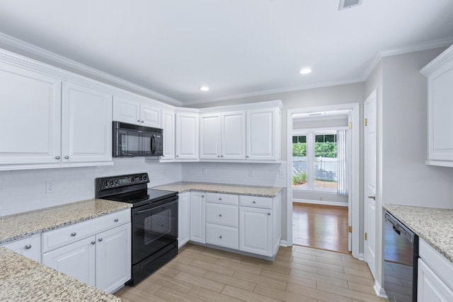 6756 Hickory Manor Cir, Chattanooga, TN 37421 - kitchen featuring black appliances, light wood-style flooring, white cabinetry, decorative backsplash, and crown molding
