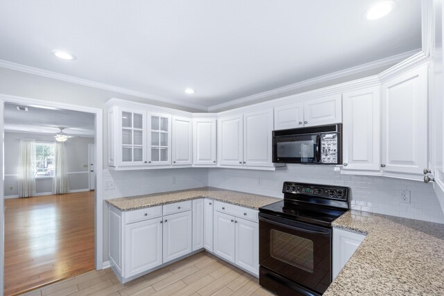 6756 Hickory Manor Cir, Chattanooga, TN 37421 - kitchen featuring black appliances, light wood-type flooring, white cabinetry, ornamental molding, and recessed lighting