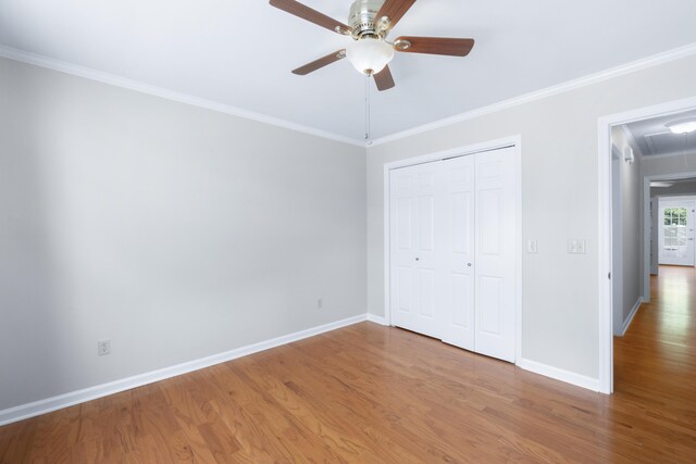 6756 Hickory Manor Cir, Chattanooga, TN 37421 - unfurnished bedroom featuring attic access, wood finished floors, crown molding, a closet, and a ceiling fan
