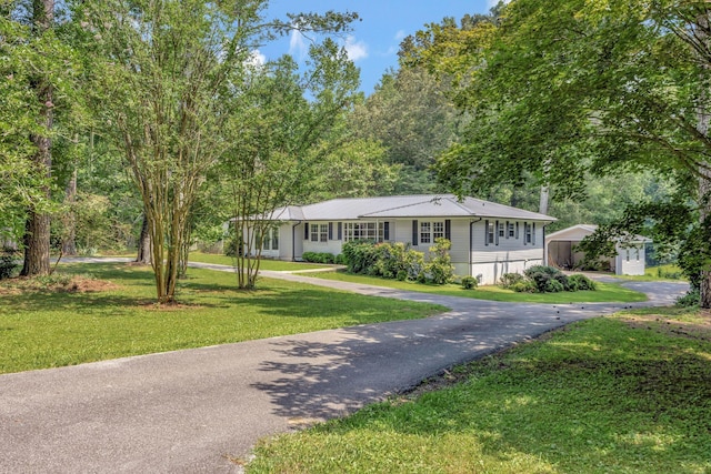 15 Moon Beam Cir, Rock Spring, GA 30739 - single story home with asphalt driveway, a front yard, and a detached carport