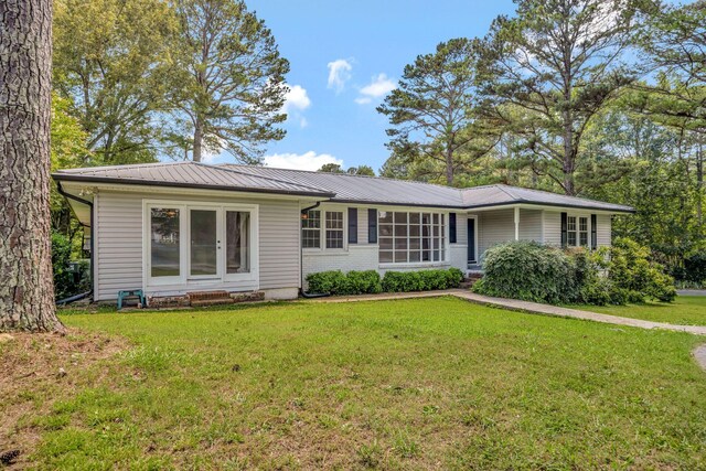 15 Moon Beam Cir, Rock Spring, GA 30739 - ranch-style home with a front yard and a metal roof