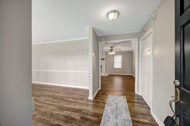 15 Moon Beam Cir, Rock Spring, GA 30739 - foyer featuring ceiling fan, dark wood-type flooring, a textured ceiling, and ornamental molding