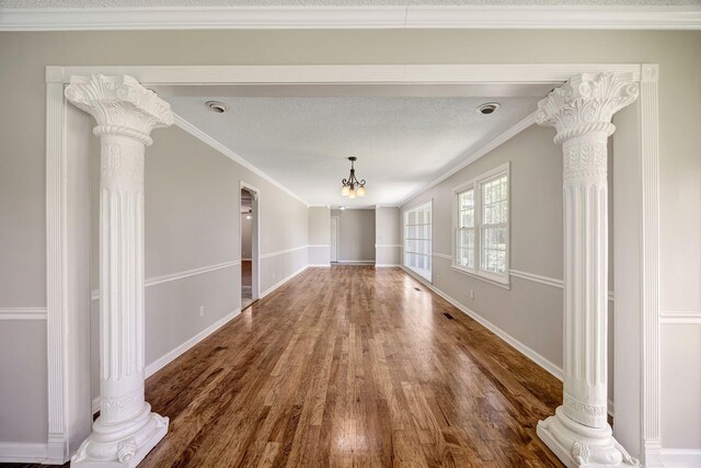 15 Moon Beam Cir, Rock Spring, GA 30739 - unfurnished dining area with decorative columns and wood finished floors