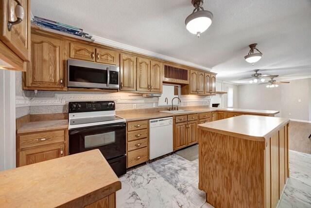 15 Moon Beam Cir, Rock Spring, GA 30739 - kitchen with stainless steel microwave, white dishwasher, electric range, light countertops, and crown molding