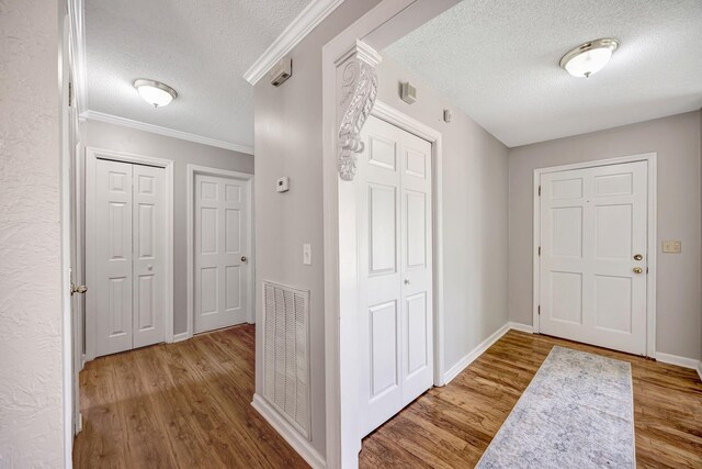 15 Moon Beam Cir, Rock Spring, GA 30739 - entryway featuring a textured ceiling, wood finished floors, and ornamental molding