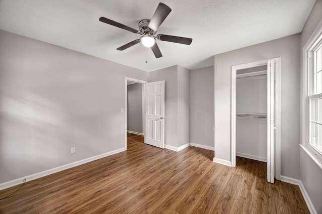 15 Moon Beam Cir, Rock Spring, GA 30739 - unfurnished bedroom with wood finished floors, a closet, ceiling fan, and a textured ceiling