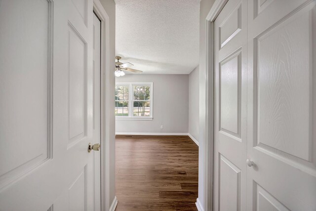 15 Moon Beam Cir, Rock Spring, GA 30739 - hallway with dark wood-style floors and a textured ceiling
