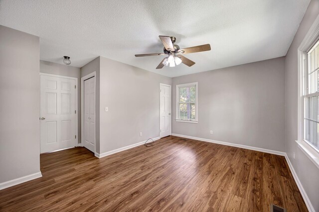 15 Moon Beam Cir, Rock Spring, GA 30739 - unfurnished bedroom with wood finished floors, a textured ceiling, and ceiling fan