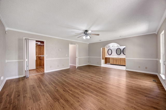 15 Moon Beam Cir, Rock Spring, GA 30739 - unfurnished living room with a textured ceiling, ceiling fan, wood finished floors, and ornamental molding