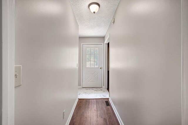 15 Moon Beam Cir, Rock Spring, GA 30739 - doorway to outside with a textured ceiling and dark wood-style floors