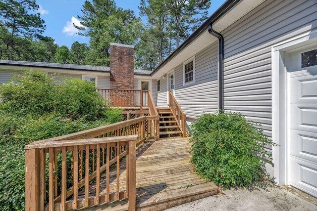 15 Moon Beam Cir, Rock Spring, GA 30739 - wooden deck featuring stairs and a garage