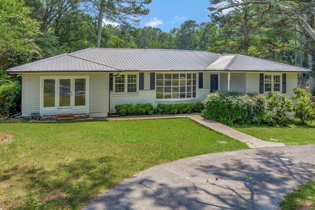 15 Moon Beam Cir, Rock Spring, GA 30739 - ranch-style home with a front yard, a metal roof, and brick siding