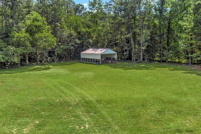 15 Moon Beam Cir, Rock Spring, GA 30739 - view of green lawn with a pole building and an outdoor structure