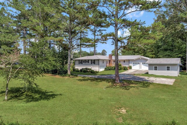 15 Moon Beam Cir, Rock Spring, GA 30739 - view of front of home with driveway, a garage, and a front lawn