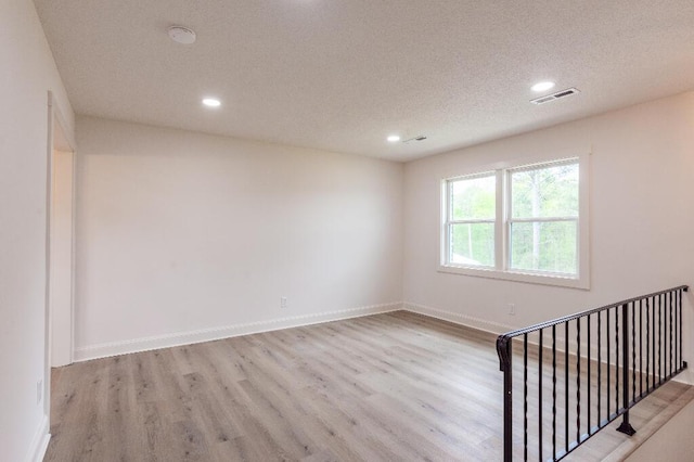 318 Yates Springs Rd, Ringgold, GA 30736 - spare room with wood finished floors, recessed lighting, a textured ceiling, and a smoke detector