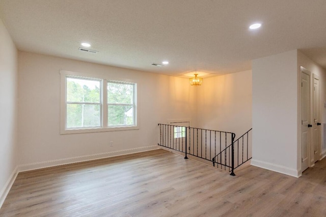 318 Yates Springs Rd, Ringgold, GA 30736 - spare room featuring wood finished floors, recessed lighting, and a chandelier