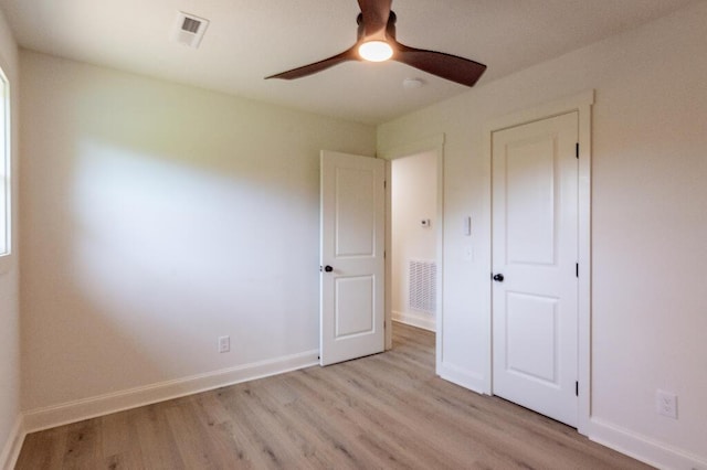 318 Yates Springs Rd, Ringgold, GA 30736 - unfurnished bedroom with light wood-style floors and a ceiling fan