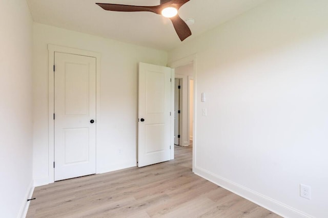 318 Yates Springs Rd, Ringgold, GA 30736 - unfurnished bedroom featuring light wood finished floors and a ceiling fan