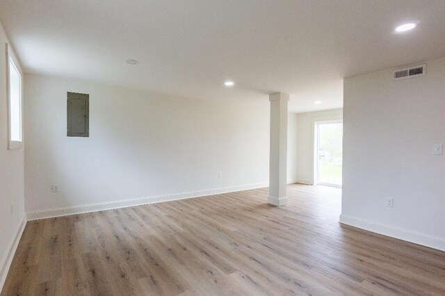 318 Yates Springs Rd, Ringgold, GA 30736 - unfurnished room featuring decorative columns, light wood-style flooring, recessed lighting, and electric panel