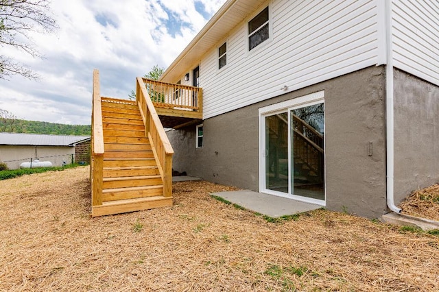 318 Yates Springs Rd, Ringgold, GA 30736 - rear view of property featuring stairs, stucco siding, and a wooden deck