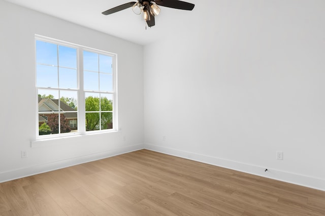 6821 Lakeshore Dr, Chattanooga, TN 37416 - empty room with light wood-style floors, healthy amount of natural light, and a ceiling fan