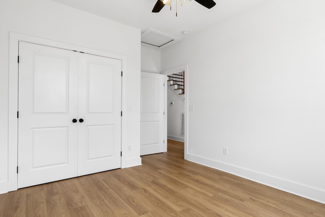 6821 Lakeshore Dr, Chattanooga, TN 37416 - unfurnished bedroom featuring light wood-style floors, a closet, attic access, and a ceiling fan