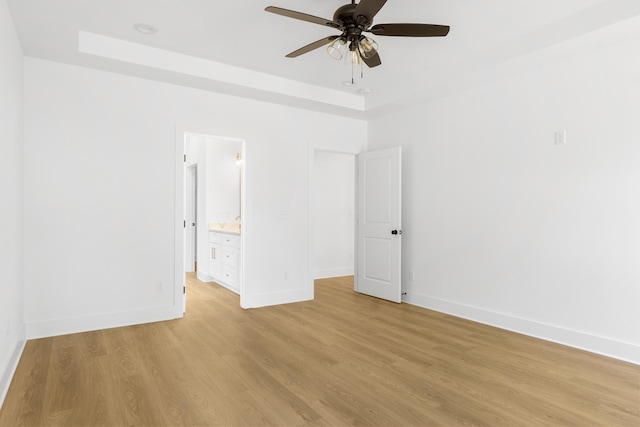 6821 Lakeshore Dr, Chattanooga, TN 37416 - unfurnished room with a raised ceiling, light wood-style flooring, and a ceiling fan