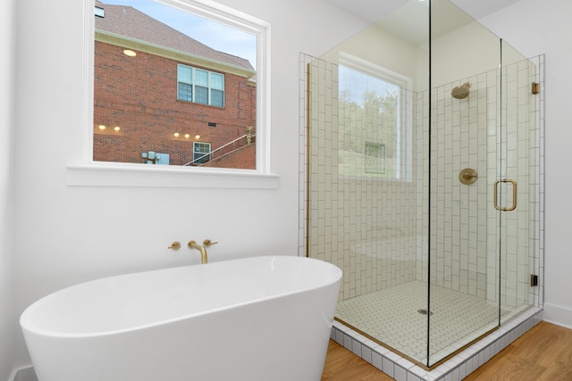 6821 Lakeshore Dr, Chattanooga, TN 37416 - full bathroom featuring wood finished floors, a shower stall, and a soaking tub