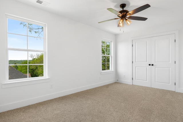 6821 Lakeshore Dr, Chattanooga, TN 37416 - unfurnished bedroom with carpet flooring, a closet, and a ceiling fan