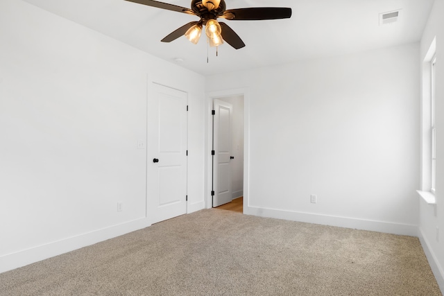 6821 Lakeshore Dr, Chattanooga, TN 37416 - unfurnished bedroom with light carpet and ceiling fan