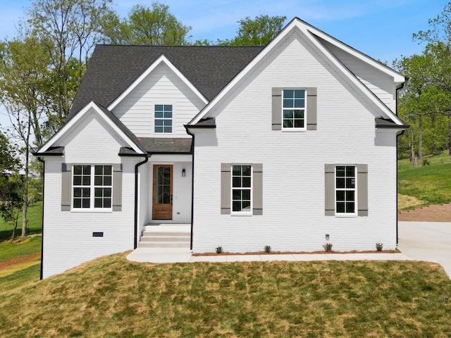 6821 Lakeshore Dr, Chattanooga, TN 37416 - view of front of home featuring brick siding, a front yard, and roof with shingles