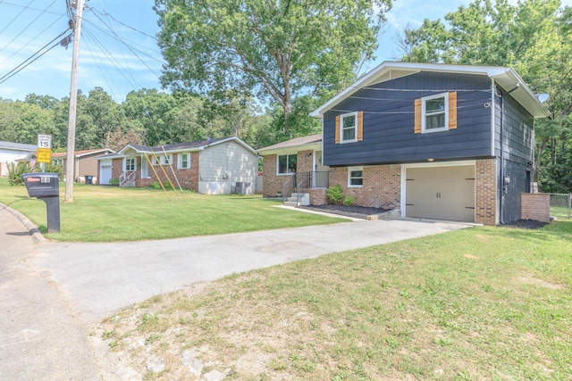 88 Sparrow Ln, Ringgold, GA 30736 - split level home with concrete driveway, brick siding, a garage, and a front lawn