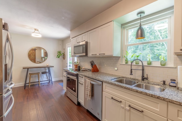 88 Sparrow Ln, Ringgold, GA 30736 - kitchen featuring stainless steel appliances, decorative backsplash, light stone countertops, and dark wood-type flooring