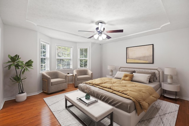 75 Sequoyah Trl, Ringgold, GA 30736 - bedroom with wood finished floors, a textured ceiling, ceiling fan, and a tray ceiling