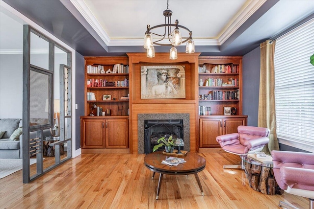 7918 Chianti Way, Chattanooga, TN 37421 - sitting room with ornamental molding, a raised ceiling, light wood-type flooring, a fireplace, and a chandelier