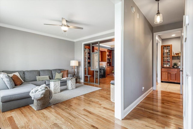 7918 Chianti Way, Chattanooga, TN 37421 - living room featuring light wood-style floors, a ceiling fan, and ornamental molding