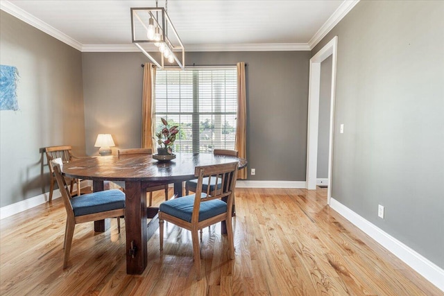 7918 Chianti Way, Chattanooga, TN 37421 - dining area featuring light wood finished floors, ornamental molding, and a chandelier