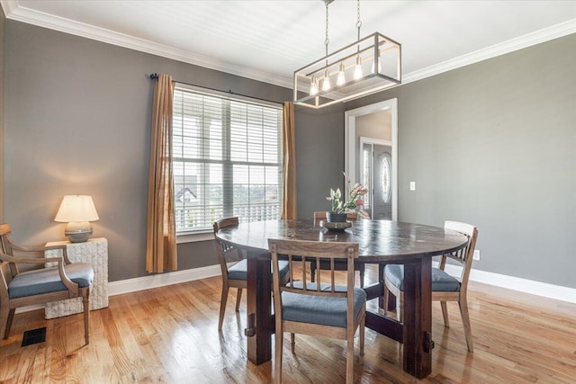 7918 Chianti Way, Chattanooga, TN 37421 - dining area with light wood-type flooring, ornamental molding, and a chandelier