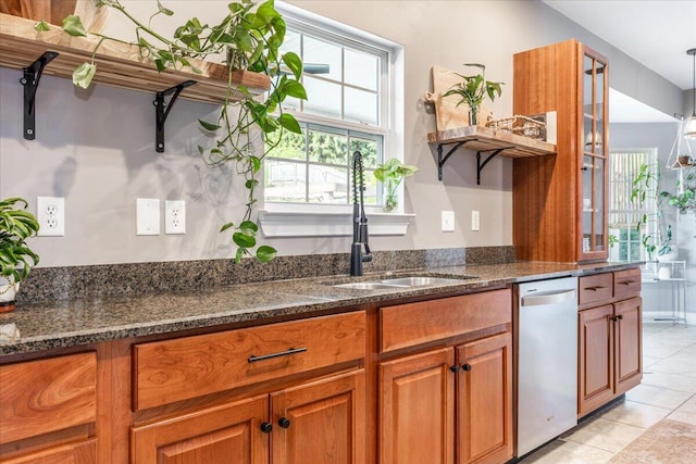 7918 Chianti Way, Chattanooga, TN 37421 - kitchen featuring stainless steel dishwasher, brown cabinetry, light tile patterned floors, dark stone counters, and open shelves