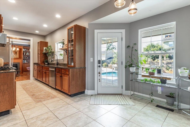 7918 Chianti Way, Chattanooga, TN 37421 - kitchen featuring brown cabinets, dishwasher, light tile patterned floors, healthy amount of natural light, and recessed lighting